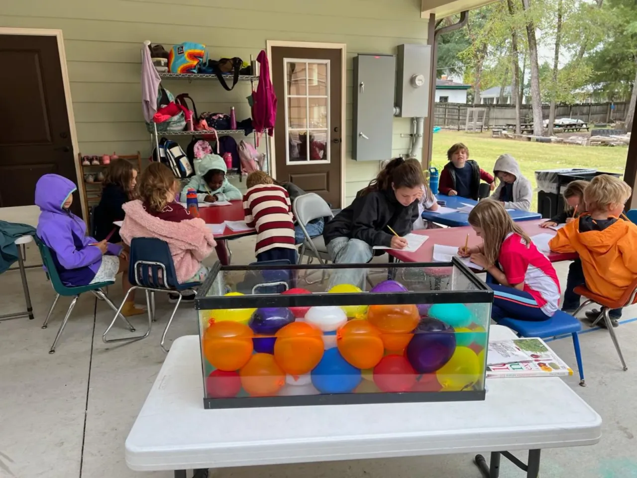 Preschool students learning together in a Montessori classroom